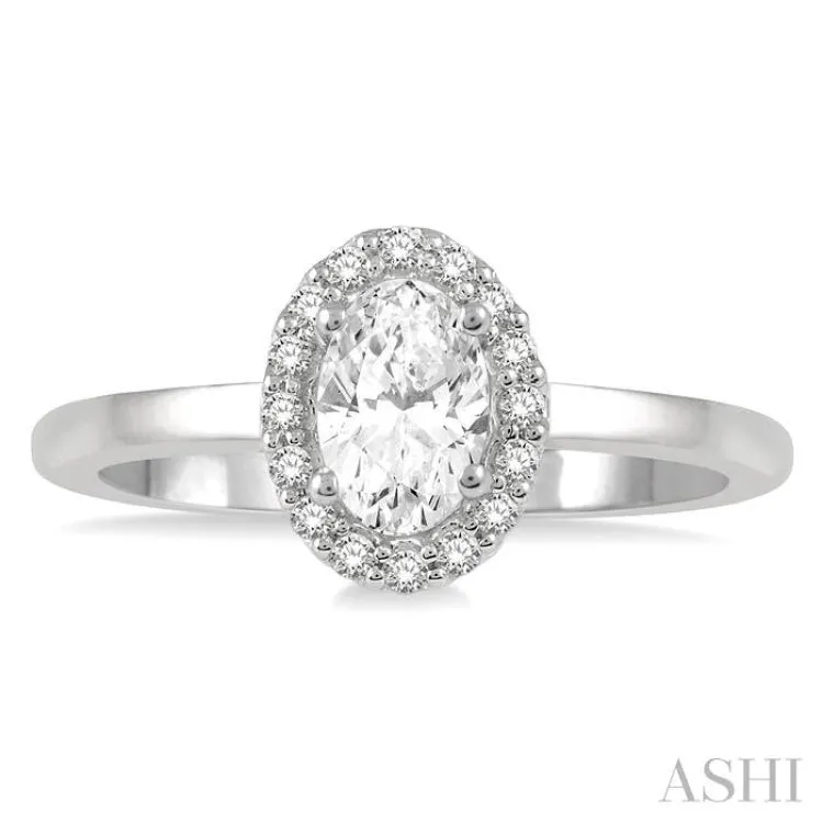 1/3 ctw Round Cut Diamond Halo Engagement Ring With 1/4 ct Oval Cut Center Stone in 14K White Gold