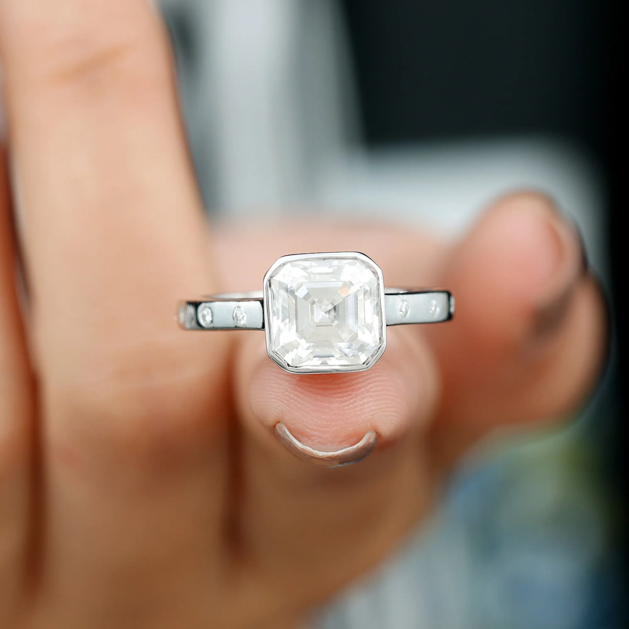 7 MM Asscher Cut Moissanite Solitaire Ring in Bezel Setting with Sleek Accent